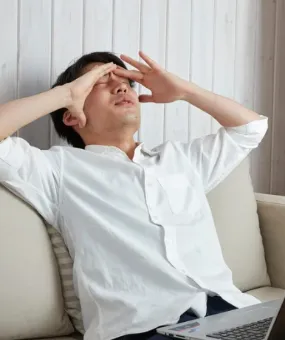 person who have is tired on the couch